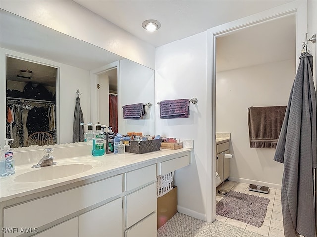 bathroom featuring tile patterned flooring and vanity