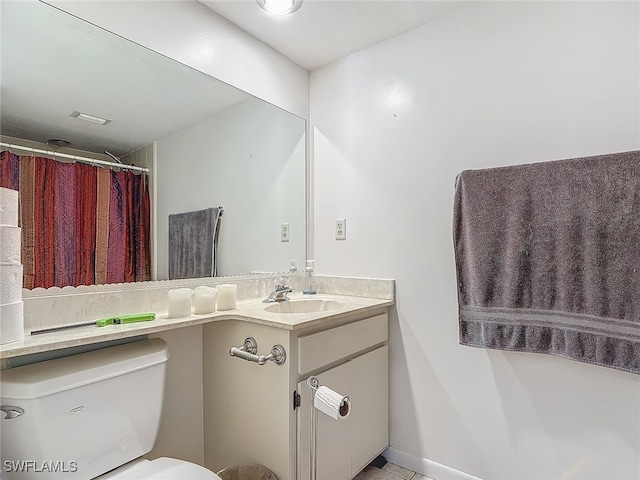 bathroom featuring vanity and toilet