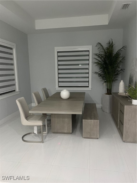 dining area featuring light tile patterned floors