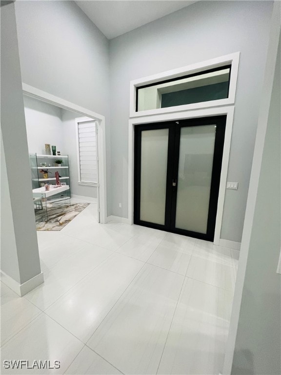 hallway featuring light tile patterned floors