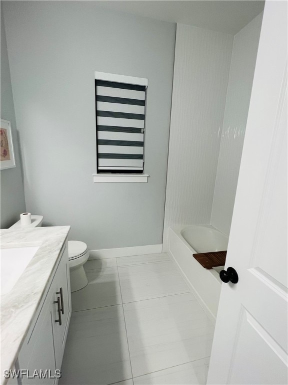 full bathroom with vanity, toilet, tile patterned floors, and shower / tub combination