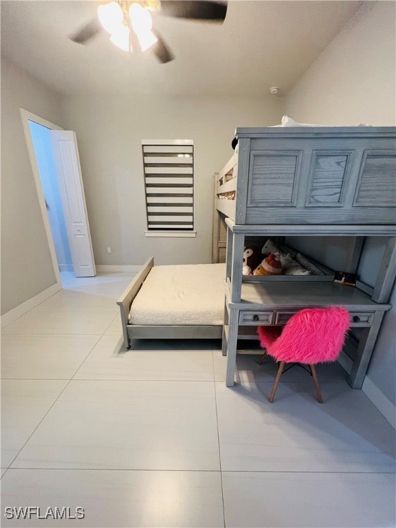 bedroom featuring light tile patterned flooring and ceiling fan