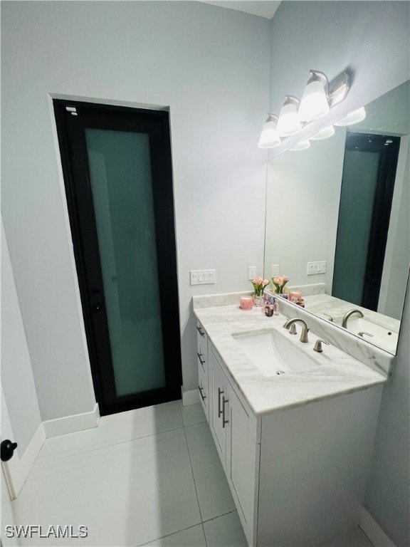 bathroom with vanity and tile patterned flooring