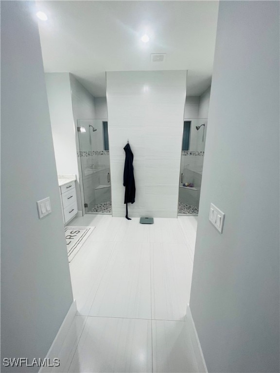 hallway with light tile patterned floors