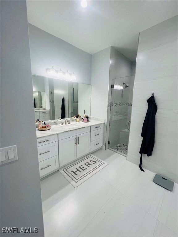 bathroom featuring vanity and walk in shower