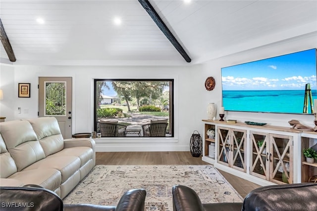 living room featuring beamed ceiling and wood-type flooring