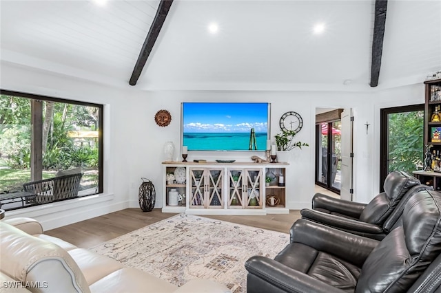 living room with lofted ceiling with beams and wood-type flooring