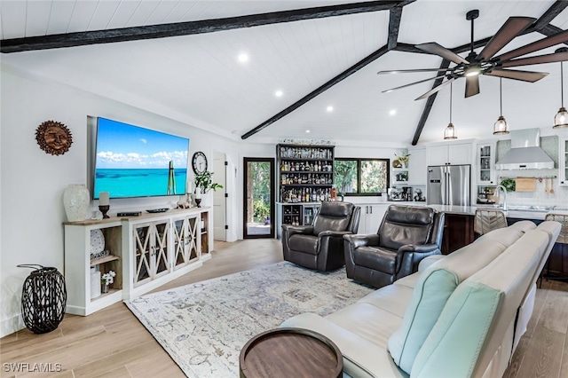 living room featuring ceiling fan, wooden ceiling, light hardwood / wood-style flooring, lofted ceiling with beams, and bar area