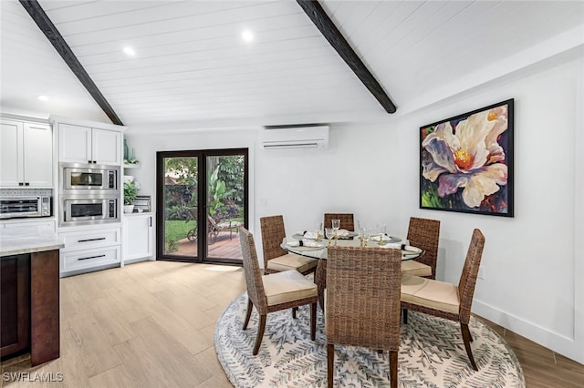 dining room featuring an AC wall unit, vaulted ceiling with beams, and light hardwood / wood-style flooring