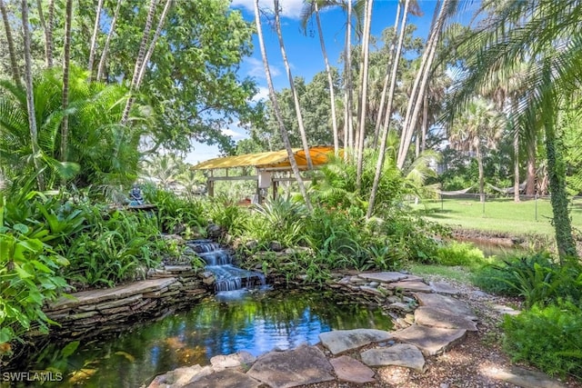 view of yard with a garden pond