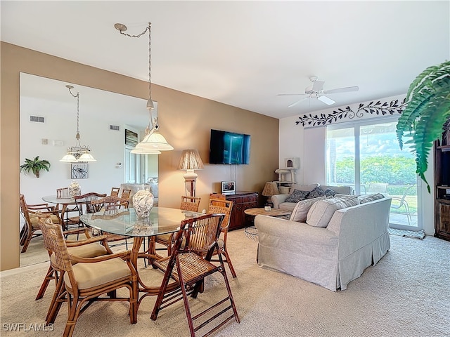 carpeted living room with ceiling fan