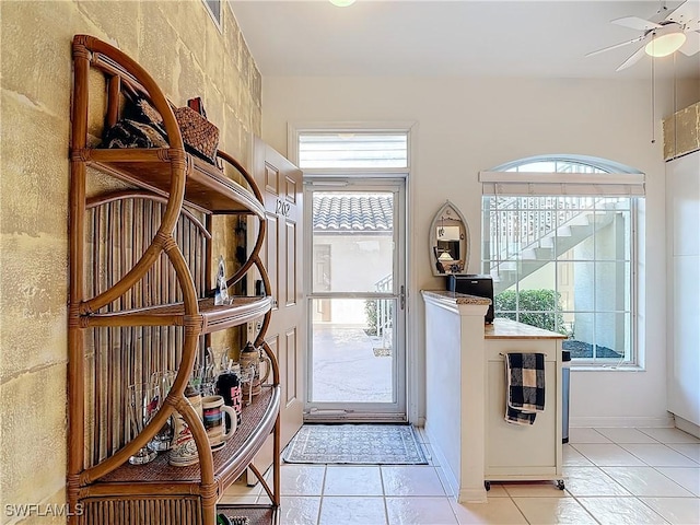 162 Newport Dr Unit 1202, Naples, FL 34114 - entryway featuring plenty of natural light, ceiling fan, and light tile patterned flooring
