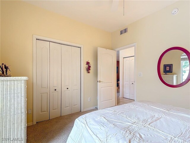 162 Newport Dr Unit 1202, Naples, FL 34114 - bedroom with a closet, light carpet, and baseboards