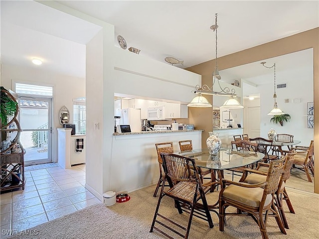 162 Newport Dr Unit 1202, Naples, FL 34114 - dining space featuring light tile patterned floors