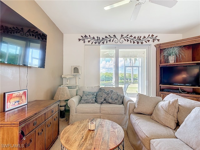 living room with ceiling fan and carpet floors