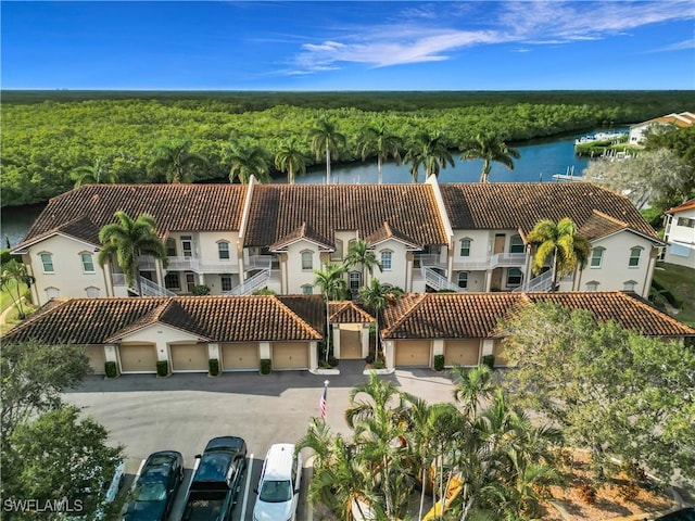 162 Newport Dr Unit 1202, Naples, FL 34114 - aerial view of a heavily wooded area and a nearby body of water