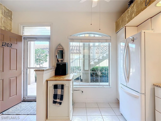 162 Newport Dr Unit 1202, Naples, FL 34114 - kitchen with freestanding refrigerator and light tile patterned flooring