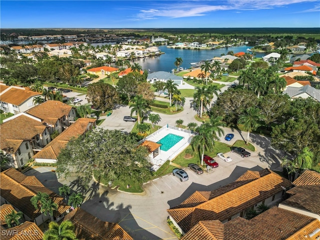 birds eye view of property featuring a water view