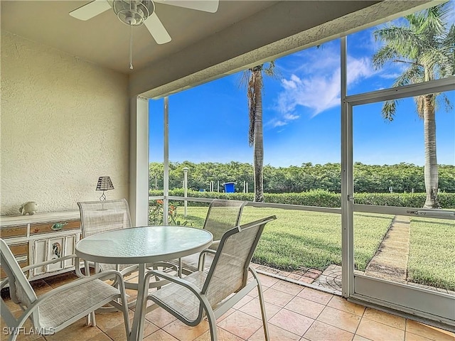 162 Newport Dr Unit 1202, Naples, FL 34114 - sunroom with ceiling fan and outdoor dining area
