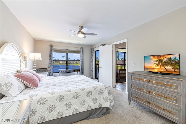 carpeted bedroom featuring access to exterior and ceiling fan