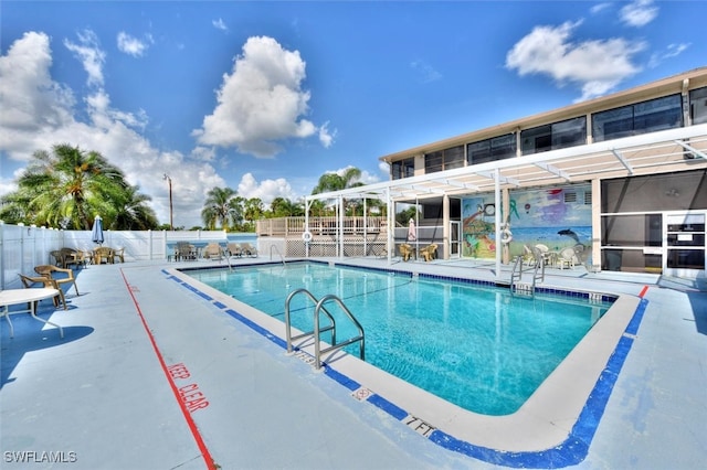 view of swimming pool featuring a patio