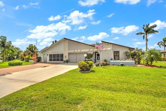 view of front of property featuring a garage and a front yard