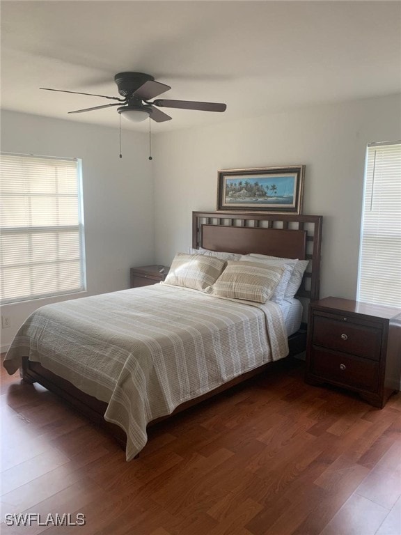 bedroom featuring ceiling fan and dark hardwood / wood-style flooring