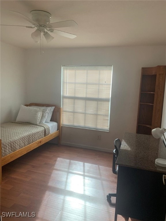 bedroom featuring hardwood / wood-style flooring and ceiling fan