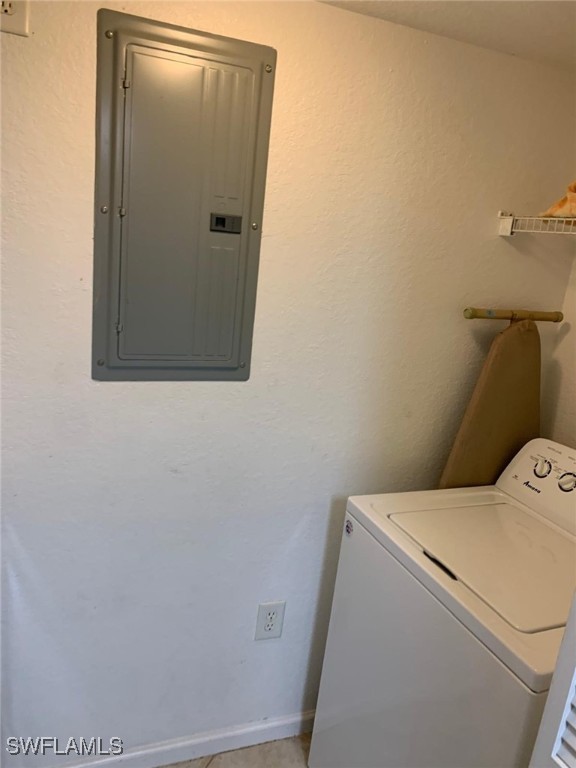 washroom featuring washer / dryer and electric panel