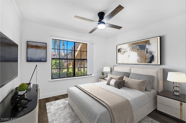 bedroom featuring dark wood-type flooring and ceiling fan