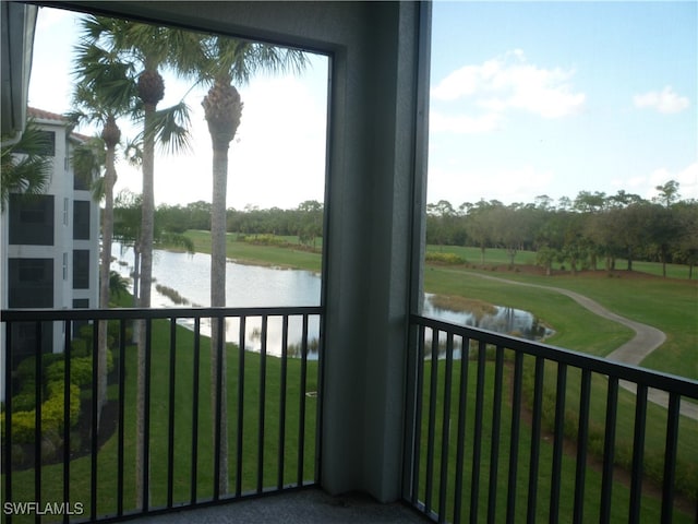 balcony featuring a water view