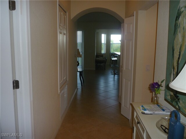 hallway with tile patterned flooring