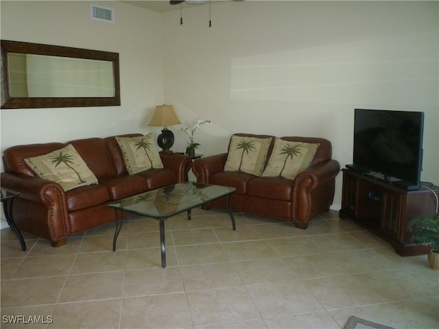 living room featuring light tile patterned flooring and ceiling fan