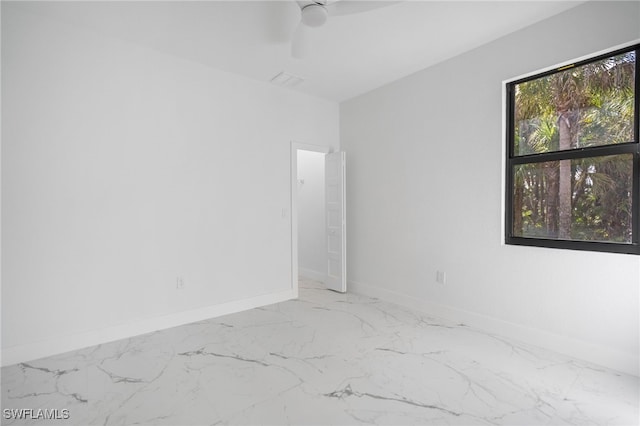 empty room featuring ceiling fan