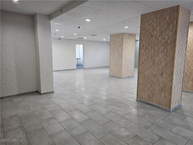 empty room with a textured ceiling