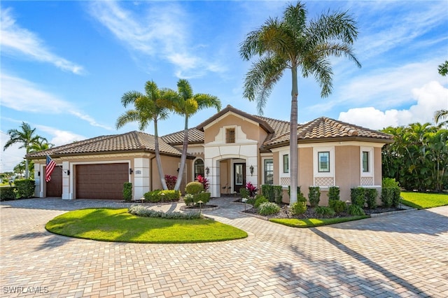 mediterranean / spanish-style house featuring a garage