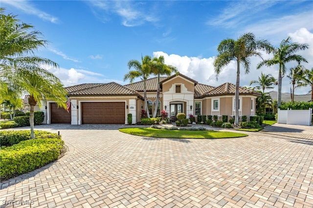 mediterranean / spanish house with a garage