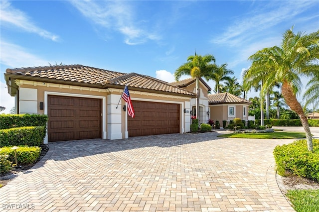 mediterranean / spanish-style home featuring a garage