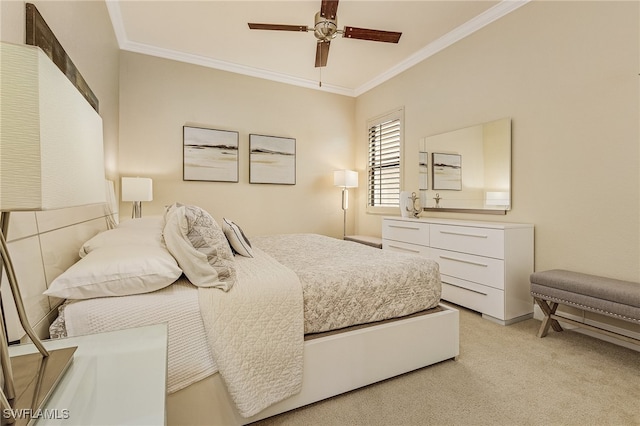 carpeted bedroom featuring ceiling fan and ornamental molding