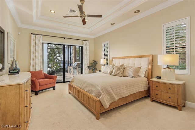 carpeted bedroom with ornamental molding, a tray ceiling, access to outside, and ceiling fan