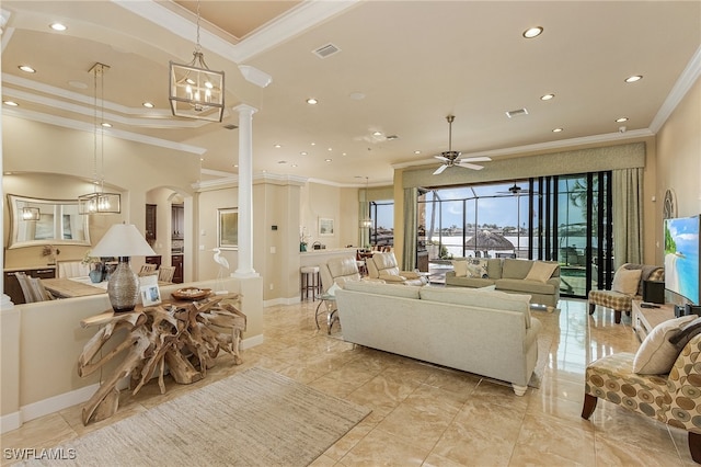 living room featuring ornate columns, ornamental molding, and ceiling fan