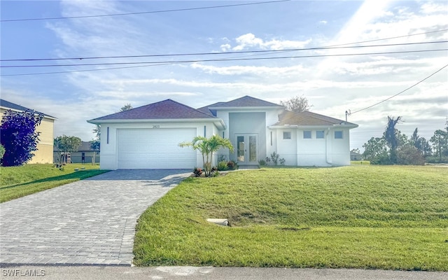 single story home featuring a front yard and a garage