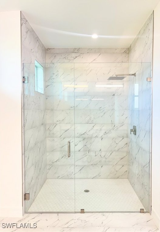 bathroom featuring an enclosed shower