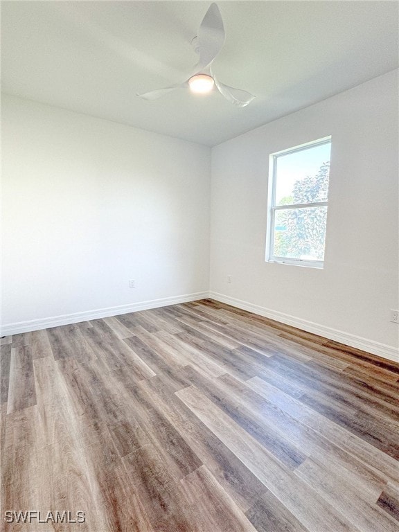 empty room featuring light hardwood / wood-style floors and ceiling fan