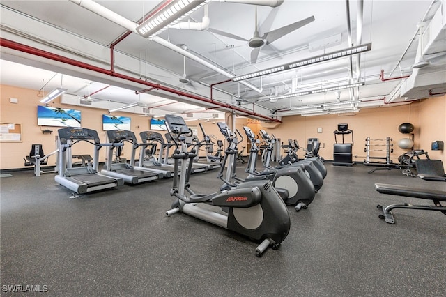 exercise room with ceiling fan