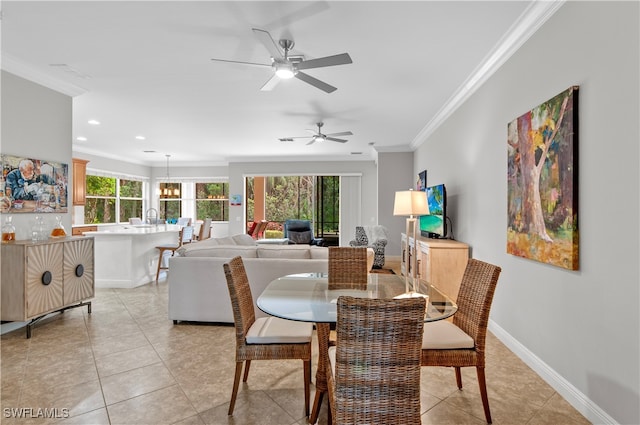 dining space featuring crown molding, sink, ceiling fan with notable chandelier, and light tile patterned floors