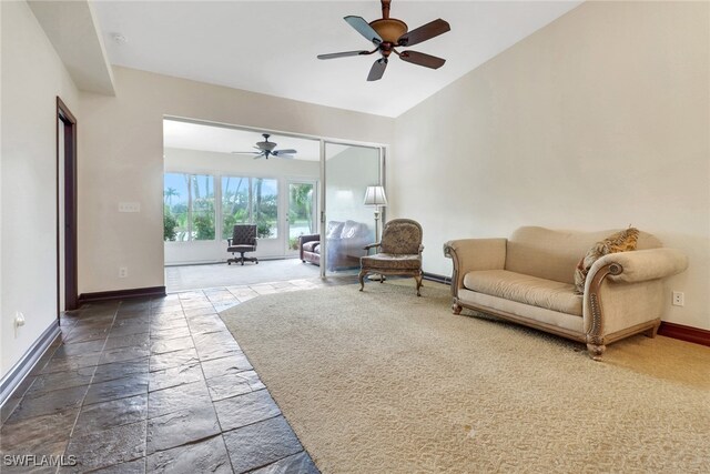 living room with lofted ceiling and ceiling fan