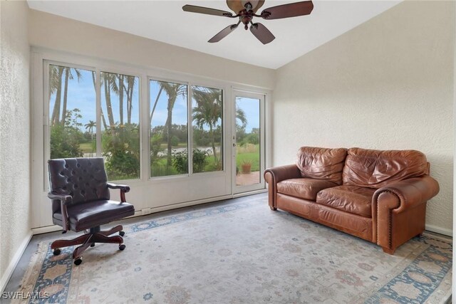 sunroom featuring ceiling fan and a healthy amount of sunlight