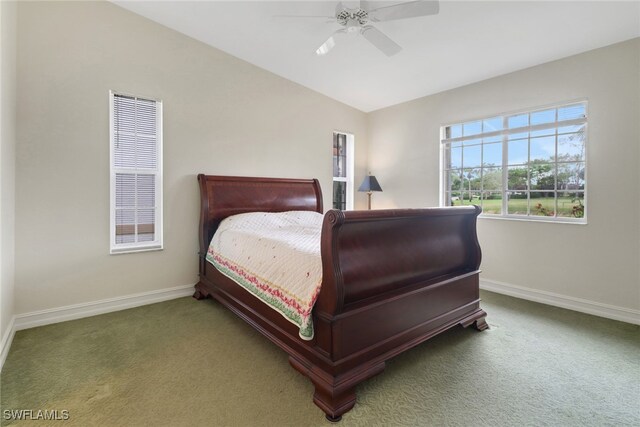 bedroom with lofted ceiling, ceiling fan, and carpet