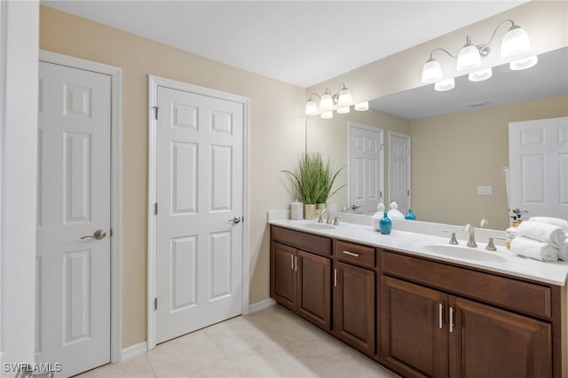 bathroom with vanity and tile patterned flooring